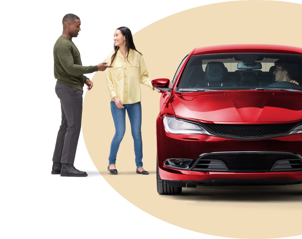 People entering a red car